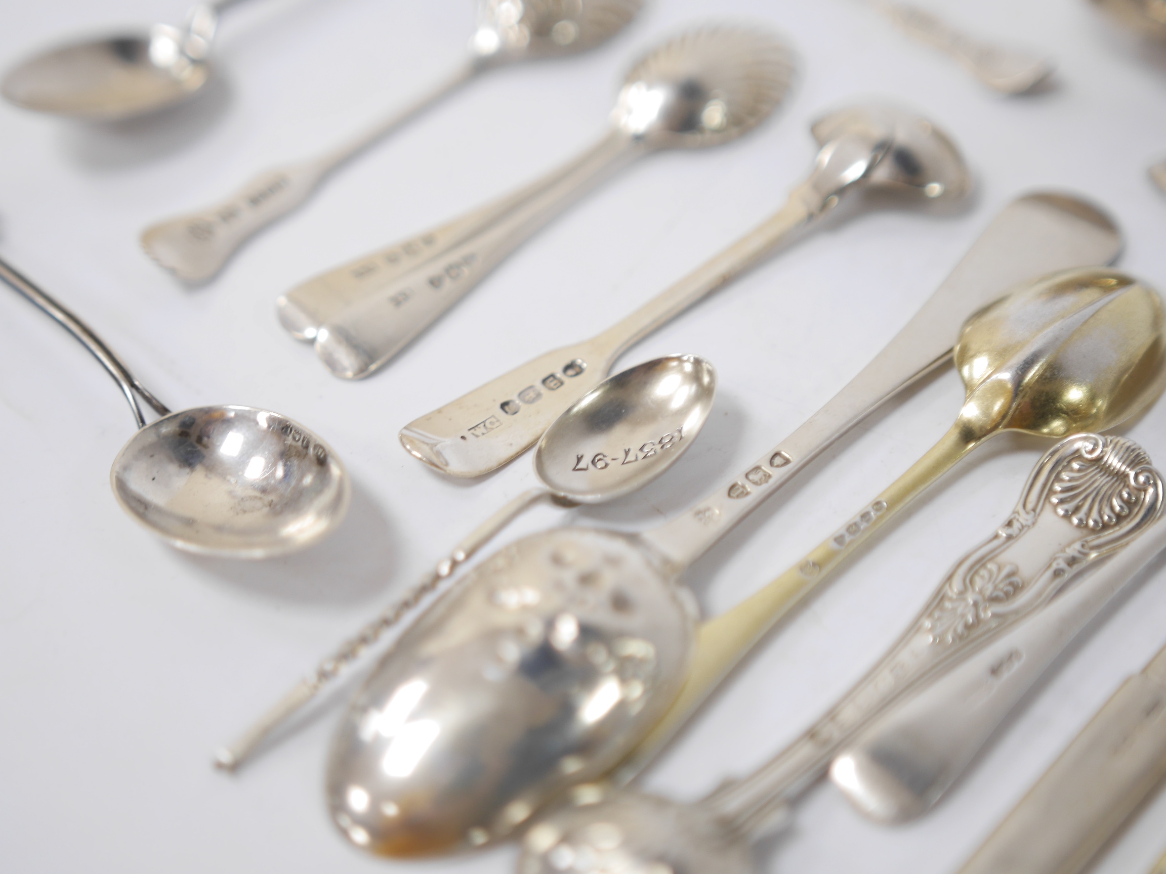 A quantity of assorted mainly 19th century and later silver flatware, including two Queens pattern sauce ladles, seventeen teaspoons, six mustard ladles, a toddy ladle, etc, and a silver pencil holder, various dates and